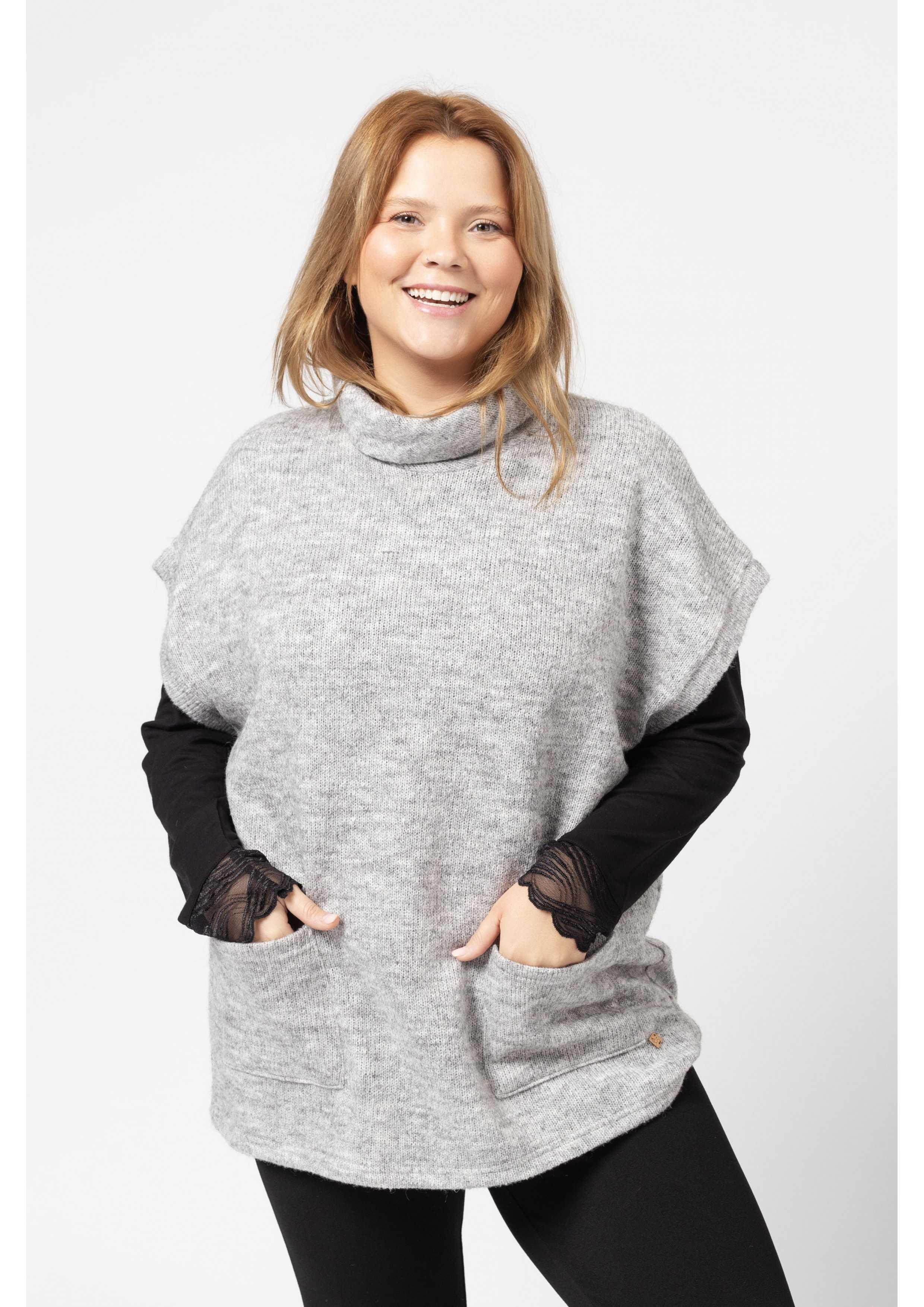 Poncho en tricot uni...